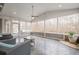 Bright sunroom featuring tile floors, comfortable seating, and large windows offering picturesque views at 210 Little River Farms Trl, Canton, GA 30115