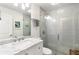 Modern bathroom featuring a glass-enclosed shower, marble countertop, and sleek fixtures at 2343 Poplar Springs Ne Dr, Brookhaven, GA 30319