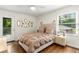 Comfortable bedroom with hardwood floors, ample natural light, and access to outdoor deck at 2343 Poplar Springs Ne Dr, Brookhaven, GA 30319