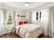Cozy bedroom with plush bedding, natural light, and stylish decorative accents at 2343 Poplar Springs Ne Dr, Brookhaven, GA 30319