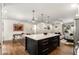 Open concept kitchen with a large center island connects to the dining and living areas at 2343 Poplar Springs Ne Dr, Brookhaven, GA 30319