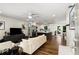 Bright and airy living room with hardwood floors, seamlessly connected to a modern kitchen, perfect for entertaining at 2343 Poplar Springs Ne Dr, Brookhaven, GA 30319