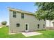 The backyard of this home is mostly grass with an outdoor patio area at 2743 High Tide Dr, Atlanta, GA 30349