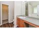 En suite bathroom includes a single sink vanity and combination shower and tub at 2743 High Tide Dr, Atlanta, GA 30349