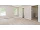 Spacious bedroom with neutral carpet and ample natural light from dual windows at 2743 High Tide Dr, Atlanta, GA 30349