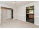 Classic dining room area with chair railing, neutral paint, carpet, and view into the kitchen at 2743 High Tide Dr, Atlanta, GA 30349