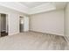 This bright main bedroom boasts trey ceilings and neutral carpeting at 2743 High Tide Dr, Atlanta, GA 30349