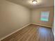 Bedroom with wood floors and natural light at 2860 Cocklebur Cove Ct, Decatur, GA 30034