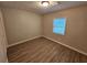 Bright bedroom with hardwood floors, neutral walls, and a window with blinds at 2860 Cocklebur Cove Ct, Decatur, GA 30034