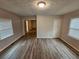 Neutral room with wood-look flooring, featuring two windows for natural light at 2860 Cocklebur Cove Ct, Decatur, GA 30034
