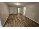 Neutral room showcasing wood-look floors and light-filled space at 2860 Cocklebur Cove Ct, Decatur, GA 30034