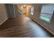 Spacious living room with wood-look flooring, leading to an open floor plan at 2860 Cocklebur Cove Ct, Decatur, GA 30034