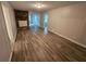 Inviting living room with a cozy stone fireplace and wood-look flooring at 2860 Cocklebur Cove Ct, Decatur, GA 30034