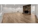 Spacious finished basement featuring a stone fireplace and modern flooring at 1260 Heards Ferry Rd, Sandy Springs, GA 30328
