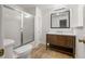 Classic bathroom with a wood vanity, shower, and toilet at 1260 Heards Ferry Rd, Sandy Springs, GA 30328
