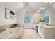 Bright bathroom with a soaking tub, double vanity and large windows at 1260 Heards Ferry Rd, Sandy Springs, GA 30328