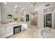Bright bathroom featuring a soaking tub, glass shower, and double vanity at 1260 Heards Ferry Rd, Sandy Springs, GA 30328
