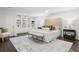 Large bedroom with built-in shelving, a decorative bed, and wood floors at 1260 Heards Ferry Rd, Sandy Springs, GA 30328