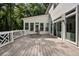 Spacious outdoor deck with white railings, overlooking the backyard and lush greenery at 1260 Heards Ferry Rd, Sandy Springs, GA 30328