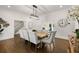 Spacious dining room with wood floors, white walls and trim, plus a modern chandelier at 1260 Heards Ferry Rd, Sandy Springs, GA 30328