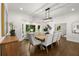 Elegant dining room with wood floors, large bay window, and stylish decor with bright natural light at 1260 Heards Ferry Rd, Sandy Springs, GA 30328