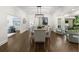 Spacious dining room with modern lighting and a large window, perfect for entertaining and Gathering gatherings at 1260 Heards Ferry Rd, Sandy Springs, GA 30328