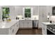 Modern kitchen with quartz counters, stainless appliances, and view of the trees at 1260 Heards Ferry Rd, Sandy Springs, GA 30328