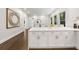 Open concept kitchen with hardwood floors, white cabinets, and quartz countertops at 1260 Heards Ferry Rd, Sandy Springs, GA 30328