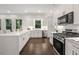 Bright kitchen with a central island, modern appliances, and lots of cabinet space at 1260 Heards Ferry Rd, Sandy Springs, GA 30328