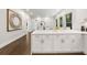 Kitchen island with white cabinets and stainless steel appliances at 1260 Heards Ferry Rd, Sandy Springs, GA 30328