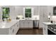 Kitchen with white cabinets, countertops, stainless steel appliances and large windows at 1260 Heards Ferry Rd, Sandy Springs, GA 30328