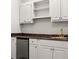 A functional kitchenette with white cabinets, dark countertops, and a stainless steel mini-fridge at 1260 Heards Ferry Rd, Sandy Springs, GA 30328
