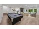 Recreation room with billiard table, stone fireplace, hardwood floors and lounge at 1260 Heards Ferry Rd, Sandy Springs, GA 30328