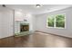Bright living room with fireplace and large window offering green views at 1260 Heards Ferry Rd, Sandy Springs, GA 30328