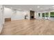 Recreation room with stone fireplace, hardwood floors, and sliding glass doors at 1260 Heards Ferry Rd, Sandy Springs, GA 30328