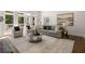 Bright living room features plush seating, large windows, and access to an outdoor balcony at 1260 Heards Ferry Rd, Sandy Springs, GA 30328