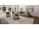 Comfortable living room features fireplace, hardwood floors, and large windows providing natural light at 1260 Heards Ferry Rd, Sandy Springs, GA 30328
