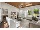 Bright sunroom featuring hardwood floors, skylights and a ceiling fan with a beautiful wooded view at 1260 Heards Ferry Rd, Sandy Springs, GA 30328