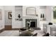 Cozy living room with built-in shelves, fireplace, and comfortable seating area at 1260 Heards Ferry Rd, Sandy Springs, GA 30328