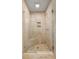 Bathroom tile shower with glass door, bench and shower niche at 1260 Heards Ferry Rd, Sandy Springs, GA 30328