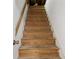 Staircase leading to a lower level with wooden steps and white walls at 1260 Heards Ferry Rd, Sandy Springs, GA 30328