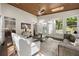 Bright sunroom with wood ceiling, abundant natural light, and views into the dining area at 1260 Heards Ferry Rd, Sandy Springs, GA 30328