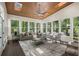 Sunroom offers abundant natural light through numerous windows, creating a warm and inviting atmosphere at 1260 Heards Ferry Rd, Sandy Springs, GA 30328
