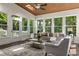 Charming sunroom with wood ceiling, large windows, and access to outdoor area at 1260 Heards Ferry Rd, Sandy Springs, GA 30328