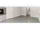 Open basement design with neutral walls and light grey floors at 1620 Concord Meadows Dr, Smyrna, GA 30082