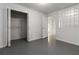 Bright room with an open closet, gray floors, and glass block window detail for a modern aesthetic at 1620 Concord Meadows Dr, Smyrna, GA 30082