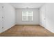 Spacious bedroom features neutral carpet, and a window at 1620 Concord Meadows Dr, Smyrna, GA 30082