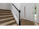 Inviting entryway features hardwood floors, carpeted stairs, and a bright white front door at 1620 Concord Meadows Dr, Smyrna, GA 30082