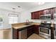Bright kitchen features stainless steel appliances, granite countertops, and eat-in breakfast nook at 1620 Concord Meadows Dr, Smyrna, GA 30082