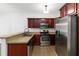 Modern kitchen with stainless appliances, granite countertops, ample cabinetry, and hardwood floors at 1620 Concord Meadows Dr, Smyrna, GA 30082